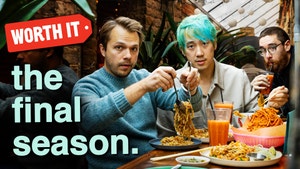 Andrew, Steven, and Adam sitting at a table with food.