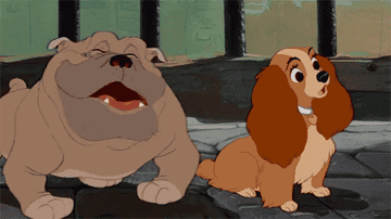 A bulldog and Lady from &quot;Lady and the Tramp&quot; sit in a kennel. Lady looks surprised while the bulldog laughs