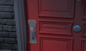 Animated GIF of a door opening to reveal Mike Wazowski and James P. Sullivan (Sulley) from Monsters, Inc. looking surprised