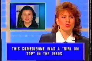 Game show screen with a question: "This comedienne was a 'Girl on Top' in the 1980s." A woman's image is displayed on the left