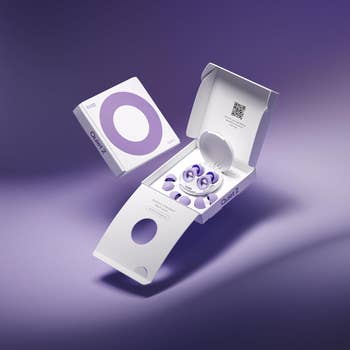 Packaging for Loop Quiet 2 earplugs, featuring open box showing earplugs and storage case, highlighting product design and functionality