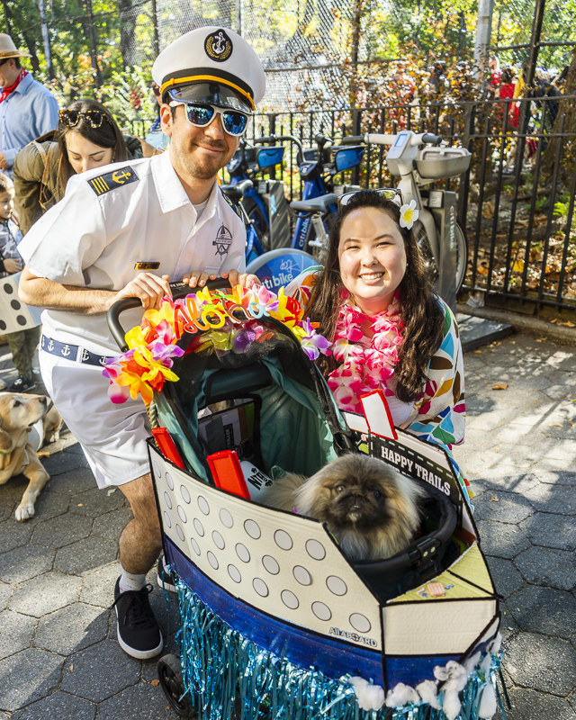 a dog and their family dressed ready to set sail