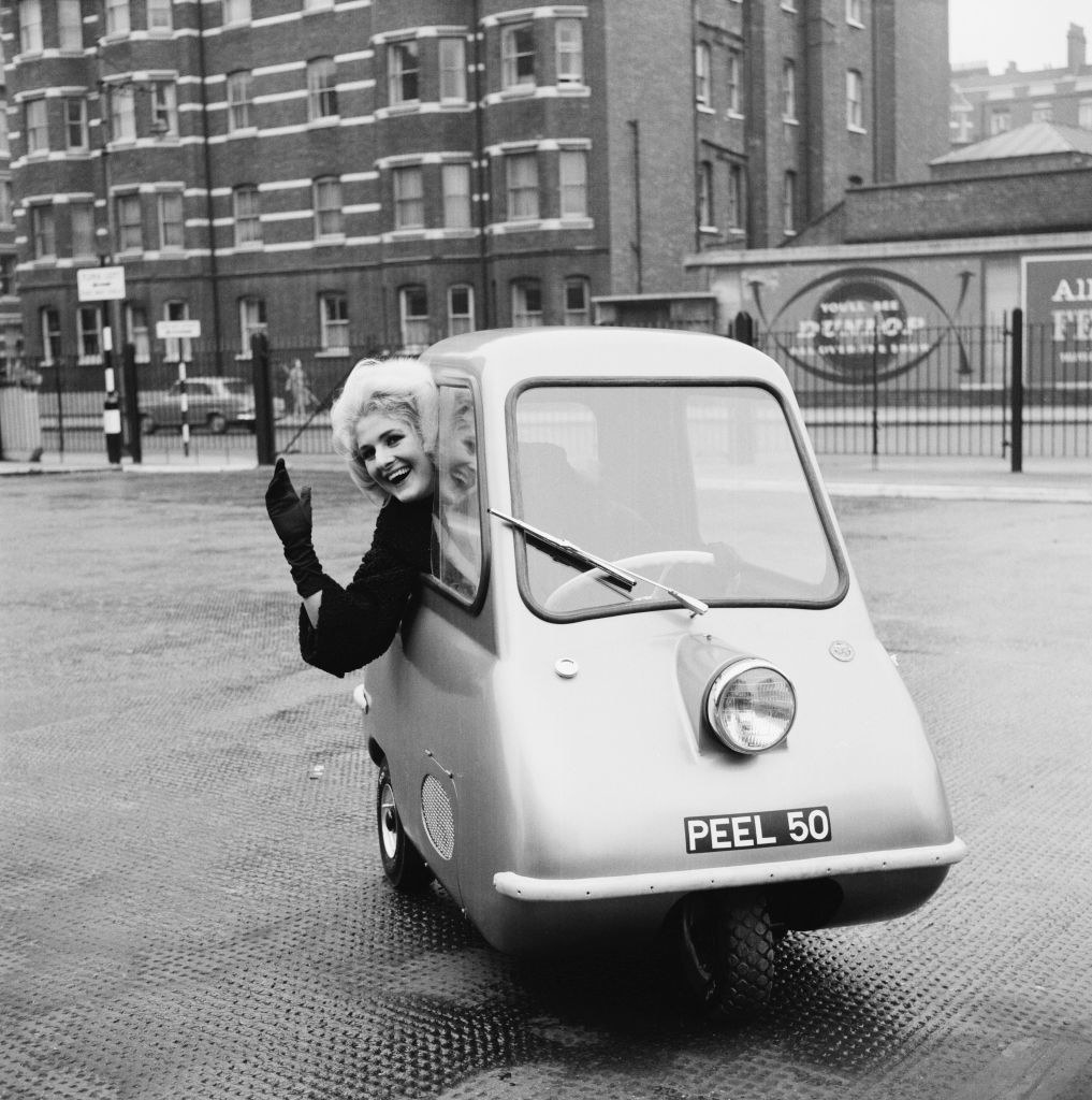 woman hanging out the window