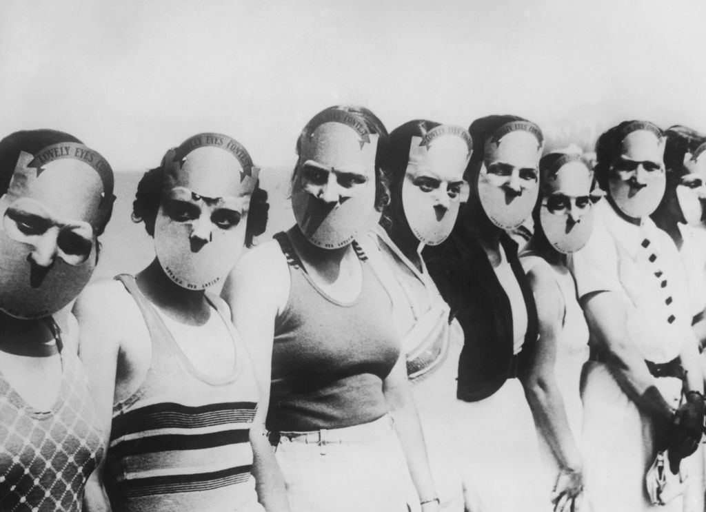 Women wearing Hannibal Lecter–type masks