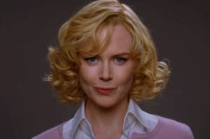 Nicole Kidman in Betwiched  with curly hair and a subtle smile